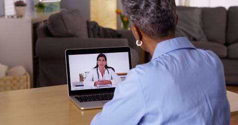 Woman conducting a virtual visit with her care provider